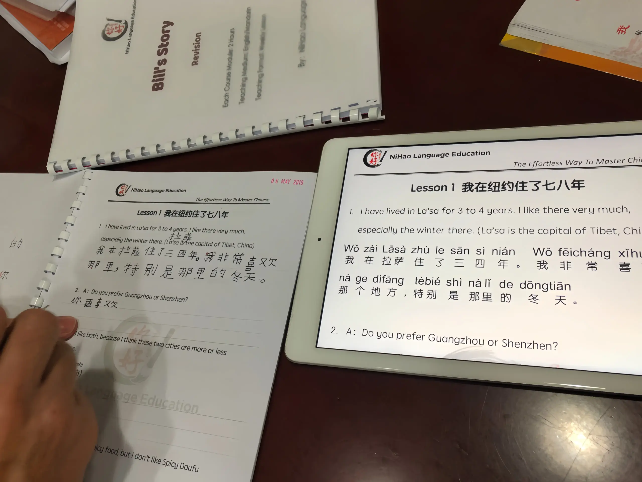 Student handwritten Chinese character practice, pinyin annotation, and professional teacher correction in Nihao Language Education's Mandarin class in Hong Kong